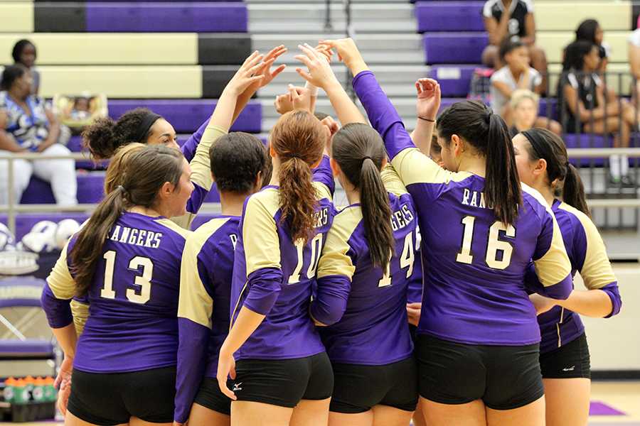 Before a game against Dunbar High School on September 13, the Varsity Lady Rangers Volleyball Team shows some of the team spirit that has led them to success. Photo by Nicholas Alvarez