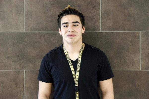 Diego Martinez shows off his Pittsburgh Penguins lanyard. Photo by Savanah Reyes