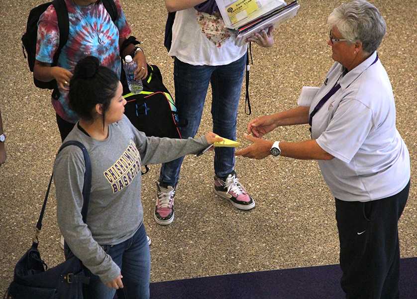 A student shows her pass to faculty member Leslie Crook in order to attend Ranger Review time tutorials. Photo by Nicholas Alvarez