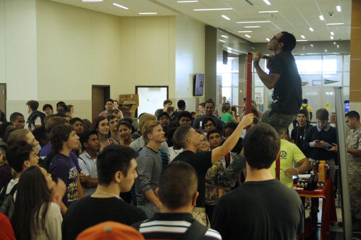 Students watch Senior Andrew Davis on his second attempt to do 20 pull ups during the Marines' visit. Photo by Colby Pierce.