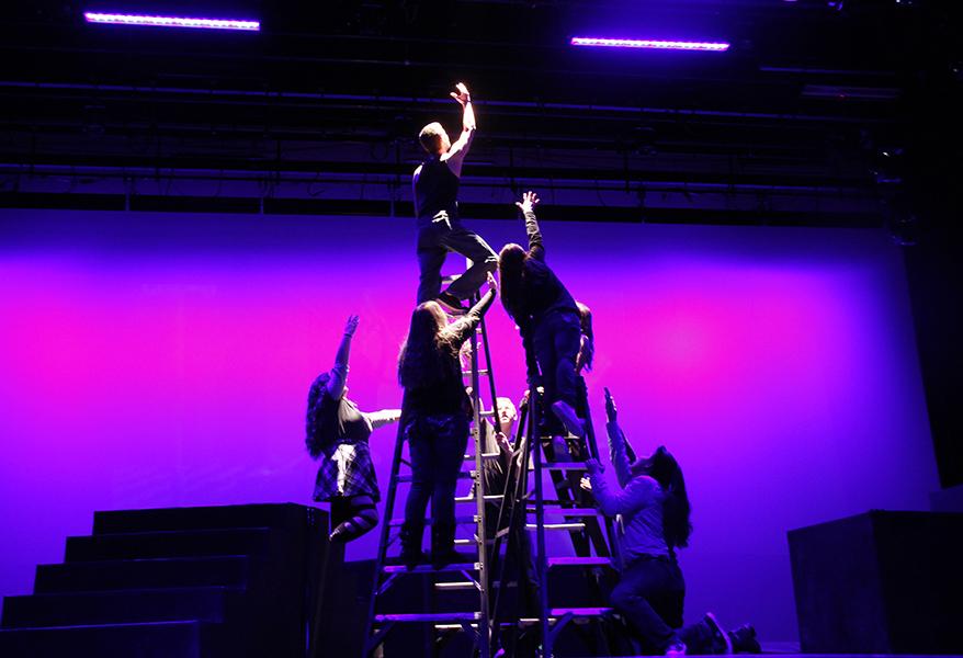 The cast of "Godspell" reaches up to the heavens at the opening of the first act of the musical Friday, Jan. 23. Photo by Kedar Collins