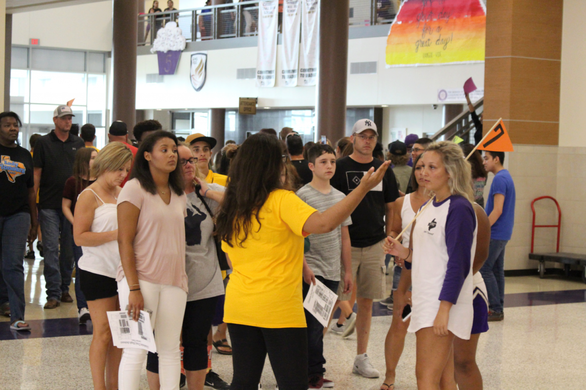 Student leaders show freshmen around the school during Fish Camp before school starts.