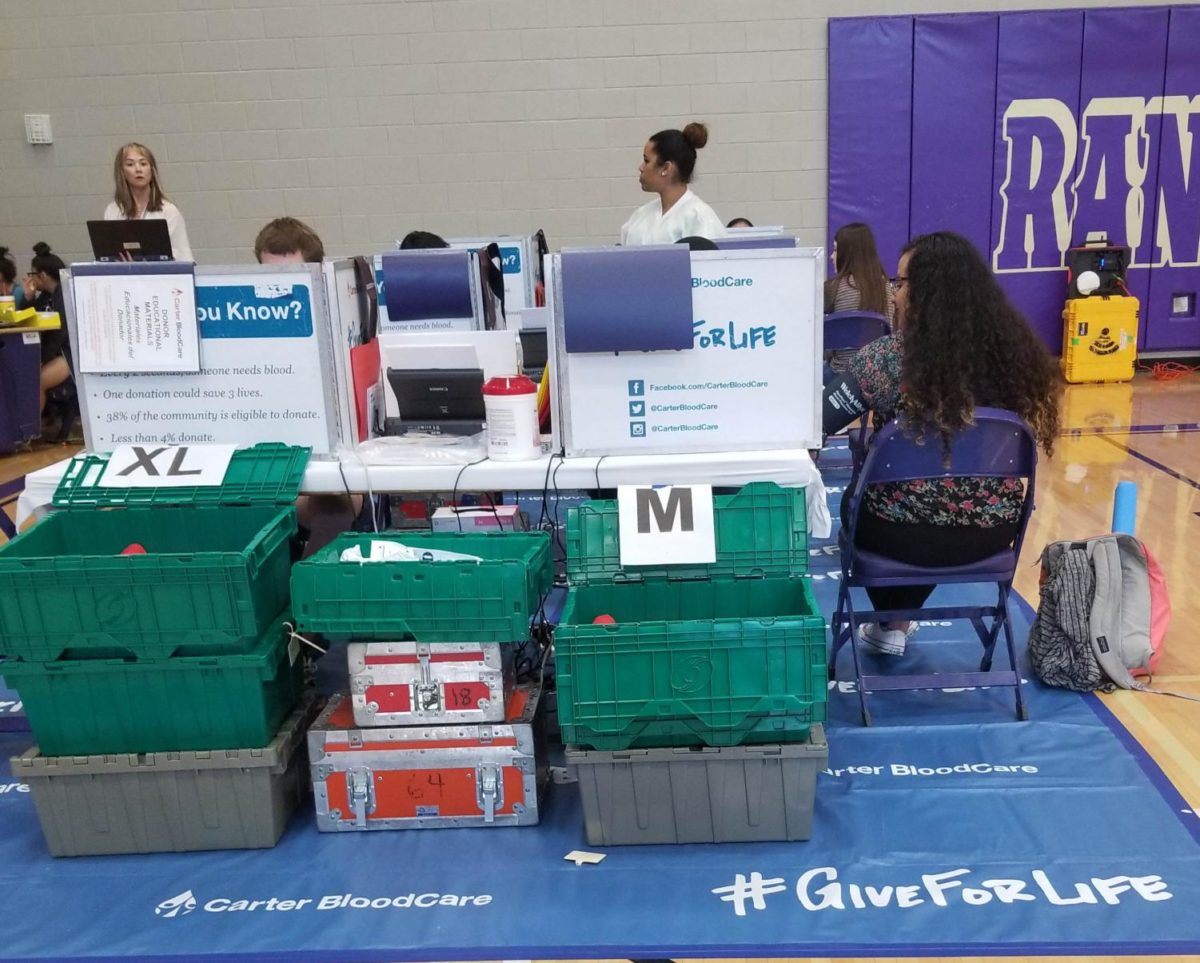 Student Council sponsored the blood drive May 1. Senior Cindy Flores does a health check before she donate blood.