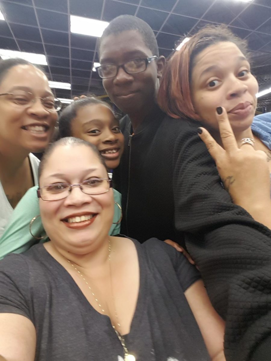 My Family: Aunt Nene (front), my mother Sheree Taylor, my sister Natalia Jones, Me, and my Aunt Sapphire. We went to an arcade/ inside playground in 2014 to have a nice family outing.