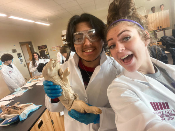 Elli Herrick and her lab partner during the Forensic Science pig autopsy.