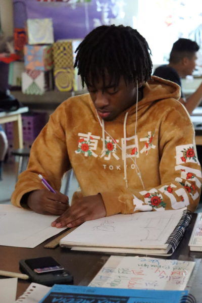 Junior Nayvon Birmingham works in his art drawing class.