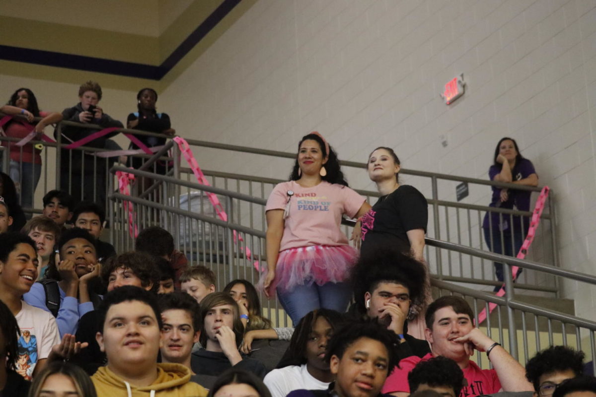 As the Pink Out pep rally goes on, teachers monitor the student sections to ensure student behaviors are managed on Friday, Oct. 7, 2022. Photo by Adrianna Garza, 12