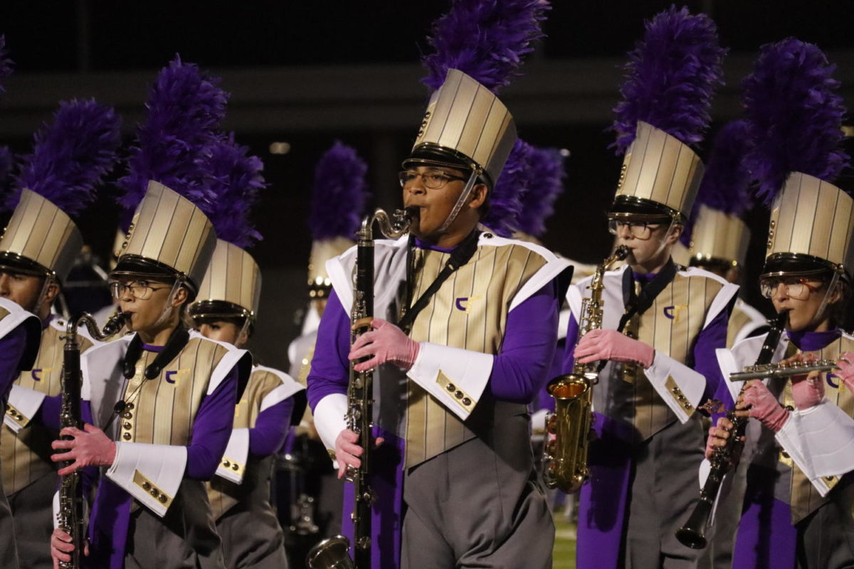 As the woodwinds perform during the halftime show, freshman bass clarinet player Anthony Jimenez, 9, plays at the Pink Out game on Friday, Oct. 7, 2022. Photo by Adrianna Garza, 12