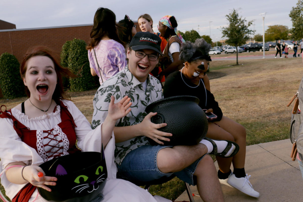 SPOOKY FUN At Chills at Chisholm, Nevaeh Kinsey, 12, and Cole Allison, 12, laugh with the theatre troop on Saturday, Oct. 22. “I thought it was really cool,” Neveah said. “I’d never been before.” Photo by Daylin Mitchell-Cochran, 12