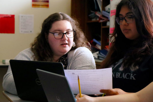 ONE PROBLEM AT A TIME As Amaris de la Cruz, 9, work on her classwork, Aurora Kitzmann, world geography teacher, helps her on the assignment on Tuesday, April 25.