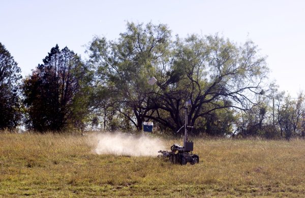 A cooler explodes after being remotely detonated.